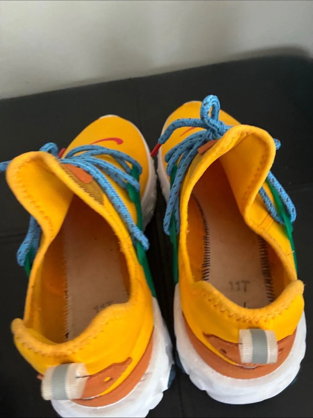 Nike Kids Yellow Sneakers with Blue Laces and Green Accents